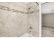 Bathroom with beige tile surround and a showerhead at 2986 Cypress Green Dr, Palm Harbor, FL 34684