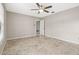 Spacious bedroom featuring a ceiling fan, neutral colors and a large window at 2986 Cypress Green Dr, Palm Harbor, FL 34684