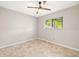 Bedroom featuring a ceiling fan, window with blinds and neutral colored walls at 2986 Cypress Green Dr, Palm Harbor, FL 34684