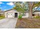 Charming single-Gathering home with neutral color palette, mature trees, and attached one-car garage at 2986 Cypress Green Dr, Palm Harbor, FL 34684