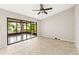 Large living room showcasing tile flooring and a large, screened in patio at 2986 Cypress Green Dr, Palm Harbor, FL 34684