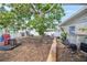 Landscaped backyard with mature trees and potential for outdoor enjoyment and relaxation in a private setting at 301 14Th Ave, Indian Rocks Beach, FL 33785