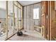 Bathroom featuring new tile flooring, natural light and walls prepped for remodeling at 301 14Th Ave, Indian Rocks Beach, FL 33785