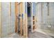 Bathroom under renovation, featuring exposed plumbing, new tiling, and potential for a modern design at 301 14Th Ave, Indian Rocks Beach, FL 33785