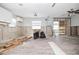 Living room with tile floors, windows, ceiling fan, and exposed walls at 301 14Th Ave, Indian Rocks Beach, FL 33785