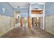 Blue walled room featuring new tile flooring and walls prepped for remodeling at 301 14Th Ave, Indian Rocks Beach, FL 33785
