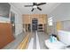 Spacious room with ceiling fan featuring new tile flooring and walls prepped for remodeling at 301 14Th Ave, Indian Rocks Beach, FL 33785
