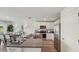 Modern kitchen featuring stainless steel appliances, sleek countertops, and an open layout to the dining area at 3050 Pink Gerbera Sq, Plant City, FL 33566