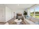 Cozy living room boasting neutral tones, stylish decor, and a view of the outdoors at 3050 Pink Gerbera Sq, Plant City, FL 33566