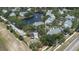 Community with a serene lake and fountain, surrounded by lush greenery and well-kept homes at 3301 Haviland Ct # 203, Palm Harbor, FL 34684