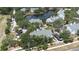 Community with a lake and fountain, surrounded by mature trees and well-maintained buildings at 3301 Haviland Ct # 203, Palm Harbor, FL 34684