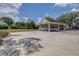 Community basketball court with a hoop, court markings, and a covered parking area for residents at 3301 Haviland Ct # 203, Palm Harbor, FL 34684