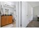 Well-lit bathroom featuring a vanity with wood cabinets and a tiled floor at 3301 Haviland Ct # 203, Palm Harbor, FL 34684
