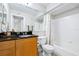 Bathroom featuring a vanity with a dark countertop, mirror, and bathtub shower at 3301 Haviland Ct # 203, Palm Harbor, FL 34684