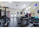 Well-equipped fitness center with exercise machines, free weights, and natural light, promoting a healthy lifestyle at 3301 Haviland Ct # 203, Palm Harbor, FL 34684