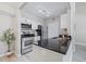 Modern kitchen with stainless steel appliances, granite countertops, and ample cabinet space, perfect for cooking and entertaining at 3301 Haviland Ct # 203, Palm Harbor, FL 34684