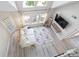 Bright view from above of the living room with vaulted ceilings, and modern decor at 3301 Haviland Ct # 203, Palm Harbor, FL 34684