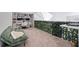Inviting loft space with a built in bookshelf, desk, and decorative greenery at 3301 Haviland Ct # 203, Palm Harbor, FL 34684