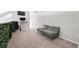 Loft space with comfortable seating area, desk, and natural light at 3301 Haviland Ct # 203, Palm Harbor, FL 34684