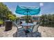Outdoor patio with a grill and seating area by the water, perfect for enjoying the community's serene atmosphere at 3301 Haviland Ct # 203, Palm Harbor, FL 34684