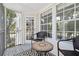 Inviting screened-in porch with outdoor seating, a tranquil retreat at 3301 Haviland Ct # 203, Palm Harbor, FL 34684