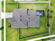 Overhead aerial view showcasing the home's roof, fenced yard, screened-in lanai, and surroundings at 33287 Sycamore Leaf Dr, Wesley Chapel, FL 33545