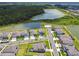 Overhead view of the homes in the community with two lakes and a forest at 33287 Sycamore Leaf Dr, Wesley Chapel, FL 33545