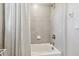 Modern bathroom featuring a tiled shower, a soaking tub, and neutral tones for a spa-like experience at 33287 Sycamore Leaf Dr, Wesley Chapel, FL 33545