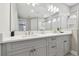 Elegant bathroom with double vanity, sleek countertops, and modern fixtures at 33287 Sycamore Leaf Dr, Wesley Chapel, FL 33545