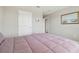 Cozy bedroom featuring soft lighting, serene decor, and a comfortable, inviting bed at 33287 Sycamore Leaf Dr, Wesley Chapel, FL 33545