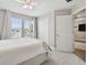 This bright bedroom features a neutral color scheme, large windows, and a spacious closet at 33287 Sycamore Leaf Dr, Wesley Chapel, FL 33545