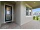 Close-up of an elegant front door with decorative glass and a welcoming entryway at 33287 Sycamore Leaf Dr, Wesley Chapel, FL 33545