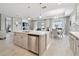 Bright kitchen features an open concept floorplan, stainless appliances and quartz countertops at 33287 Sycamore Leaf Dr, Wesley Chapel, FL 33545