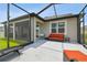 Spacious outdoor patio with comfortable seating, perfect for entertaining guests and enjoying the sunshine at 33287 Sycamore Leaf Dr, Wesley Chapel, FL 33545