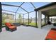 Inviting screened lanai with ample seating and views of the backyard at 33287 Sycamore Leaf Dr, Wesley Chapel, FL 33545