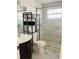 Modern bathroom featuring a glass-enclosed shower and sleek shelving at 4049 Ponea Dr, Sarasota, FL 34241