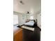 Bright bedroom features a comfortable bed, ceiling fan, and minimalist decor at 4049 Ponea Dr, Sarasota, FL 34241
