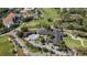Aerial view of community recreation center, including pool and golf course at 415 Mission Hills Ave, Temple Terrace, FL 33617