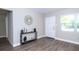 Open foyer with hardwood floors, light gray walls, and natural light at 415 Mission Hills Ave, Temple Terrace, FL 33617
