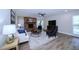 Inviting living room features fireplace, ceiling fan, and wood flooring with modern decor at 415 Mission Hills Ave, Temple Terrace, FL 33617