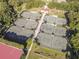 Aerial view of multiple well-maintained tennis courts with new nets and a central walkway at 415 Mission Hills Ave, Temple Terrace, FL 33617