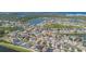 Beautiful aerial view showcasing a residential community near a lake and lush greenery at 419 Stone Briar Dr, Ruskin, FL 33570