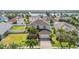 Aerial view of a beautiful home with a large lawn and surrounding community at 419 Stone Briar Dr, Ruskin, FL 33570