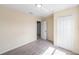 Bedroom with plush carpet, neutral walls, closet, and a doorway leading to another room at 419 Stone Briar Dr, Ruskin, FL 33570