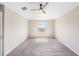 Bedroom featuring neutral walls, plush carpet, and a large window that lets in natural light at 419 Stone Briar Dr, Ruskin, FL 33570