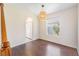 Dining area with hardwood floors, modern light fixture and a large picture window at 419 Stone Briar Dr, Ruskin, FL 33570