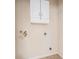 Functional laundry room featuring white cabinets and essential utility connections at 419 Stone Briar Dr, Ruskin, FL 33570