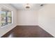 Inviting empty living room features stylish hardwood floors and a large window at 419 Stone Briar Dr, Ruskin, FL 33570