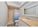 Bathroom with granite counter tops, white vanity and walk-in shower at 4463 Vieux Carre Cir, Tampa, FL 33613
