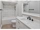 Bathroom featuring tub with tiled shower, white vanity and granite countertops at 4463 Vieux Carre Cir, Tampa, FL 33613
